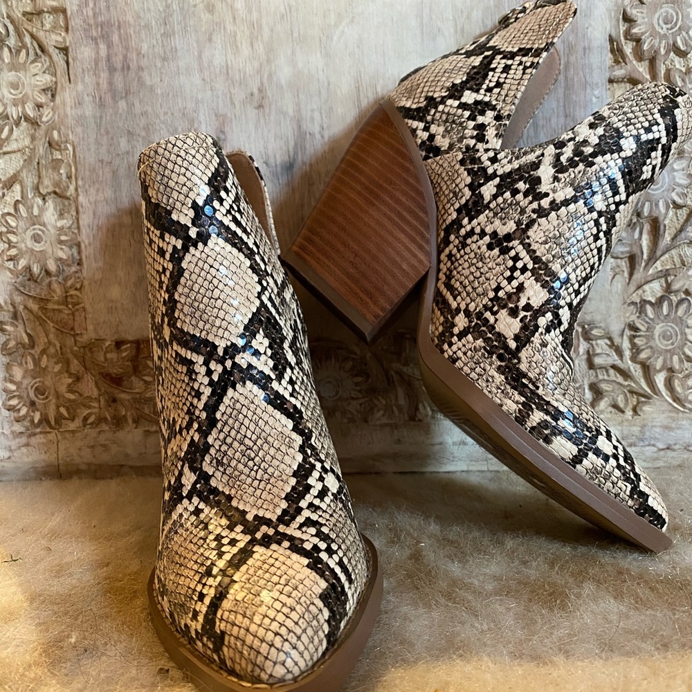 Pointed toe snake skin booties.